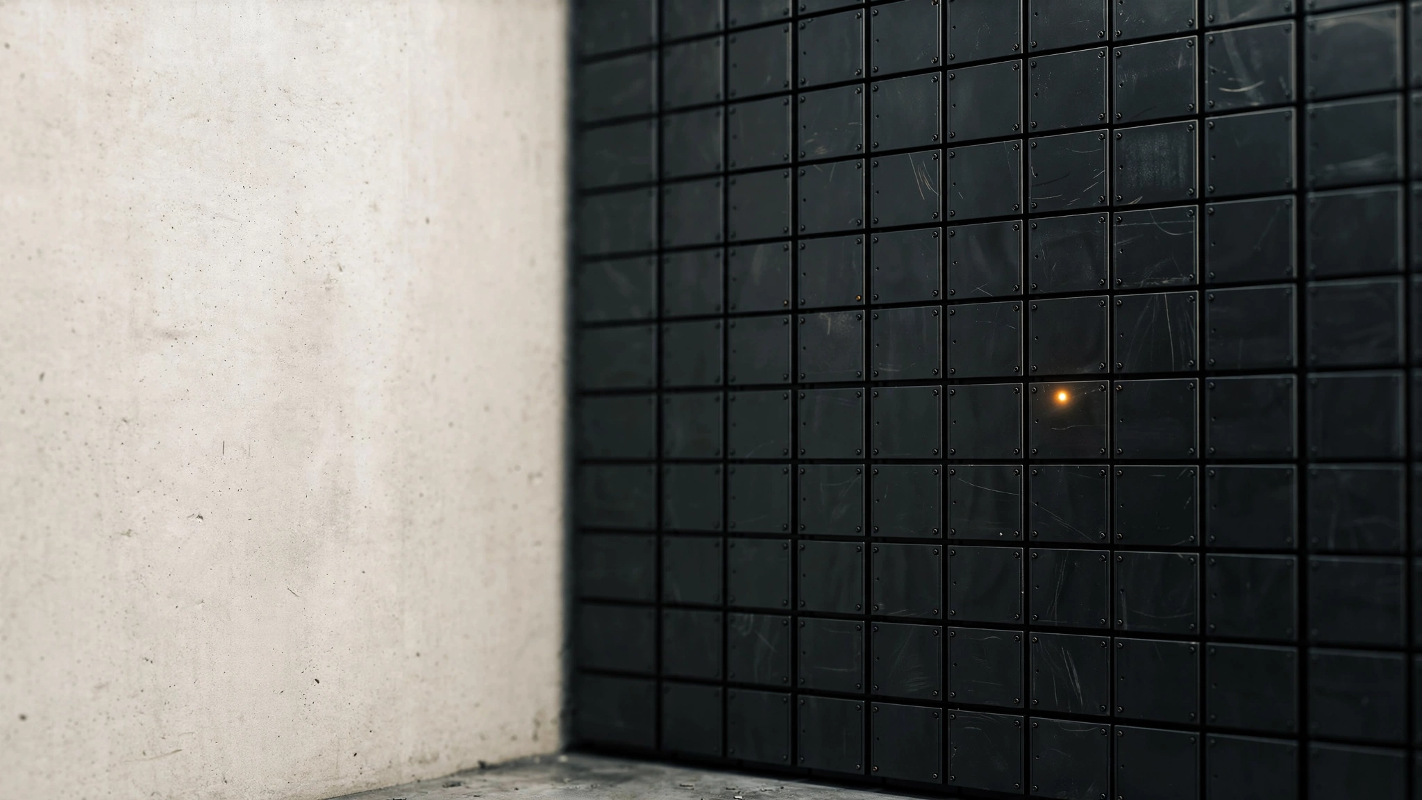 A dense wall of dark server-rack blanking panels with a single amber status light.