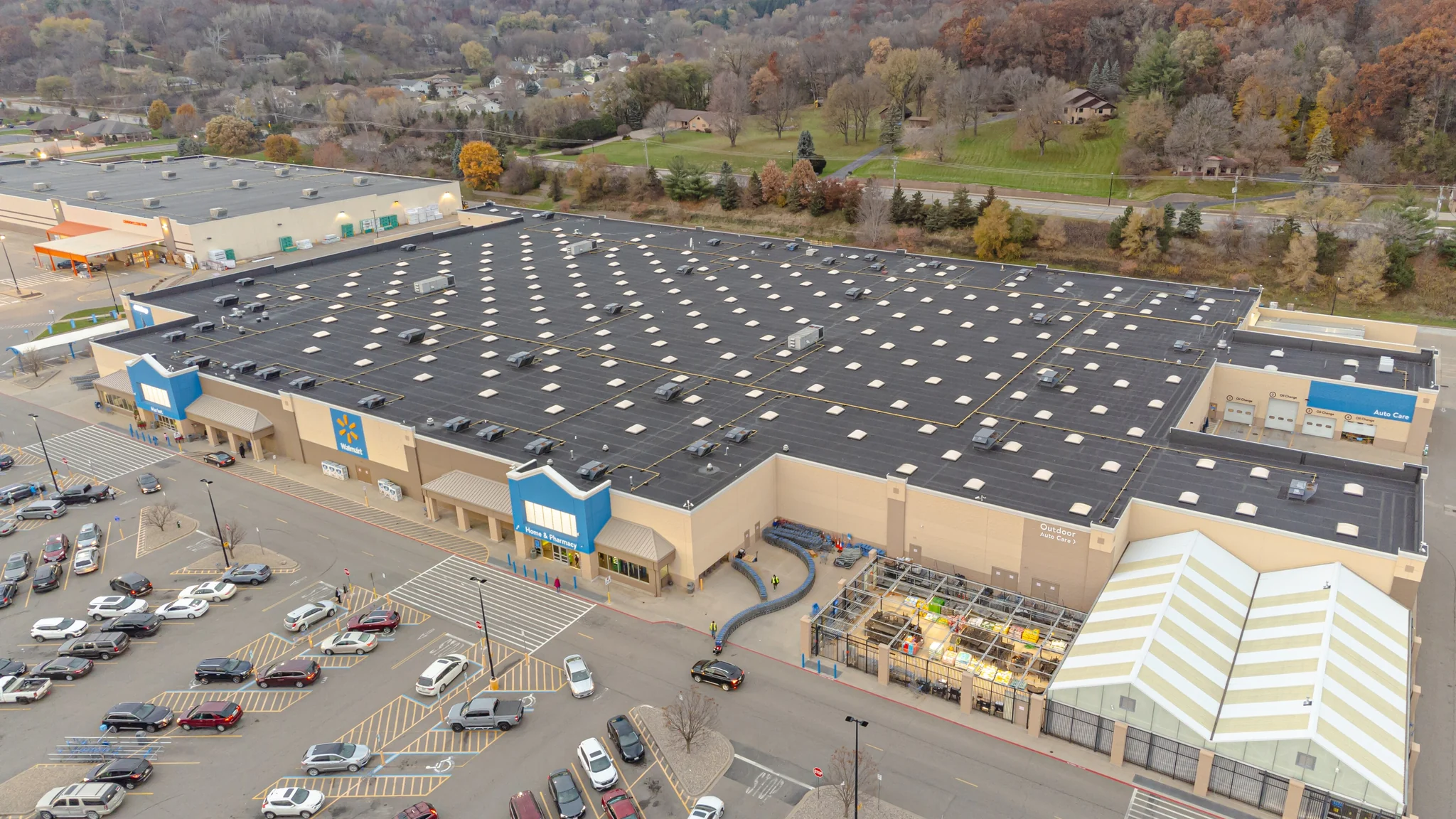 Walmart superstore exterior with parking lot.
